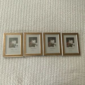 4 pieces Photo Frsmes 5”x7” gold silver